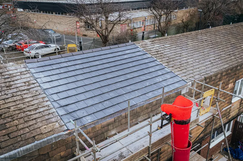 Drone view of roof works in progress on a building project