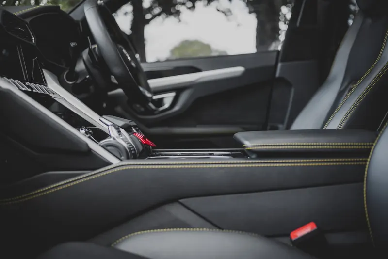 Lamborghini interior with black leather seats and centre console